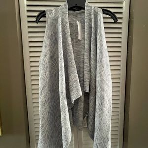 Sleeveless sweater wrap
